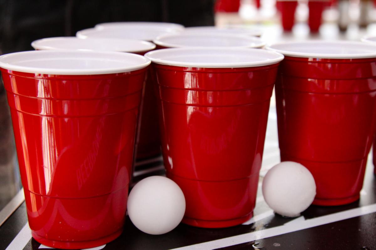 red solo cups next to ping pong balls