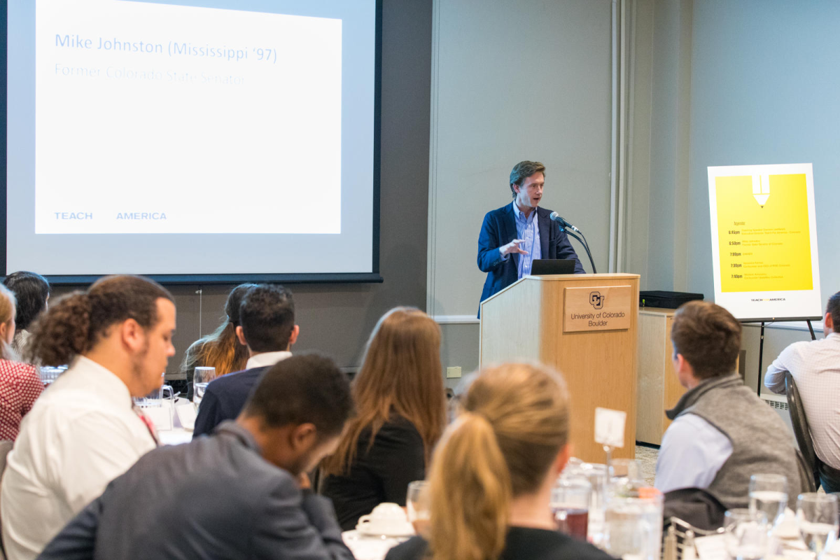 a woman giving a presentation