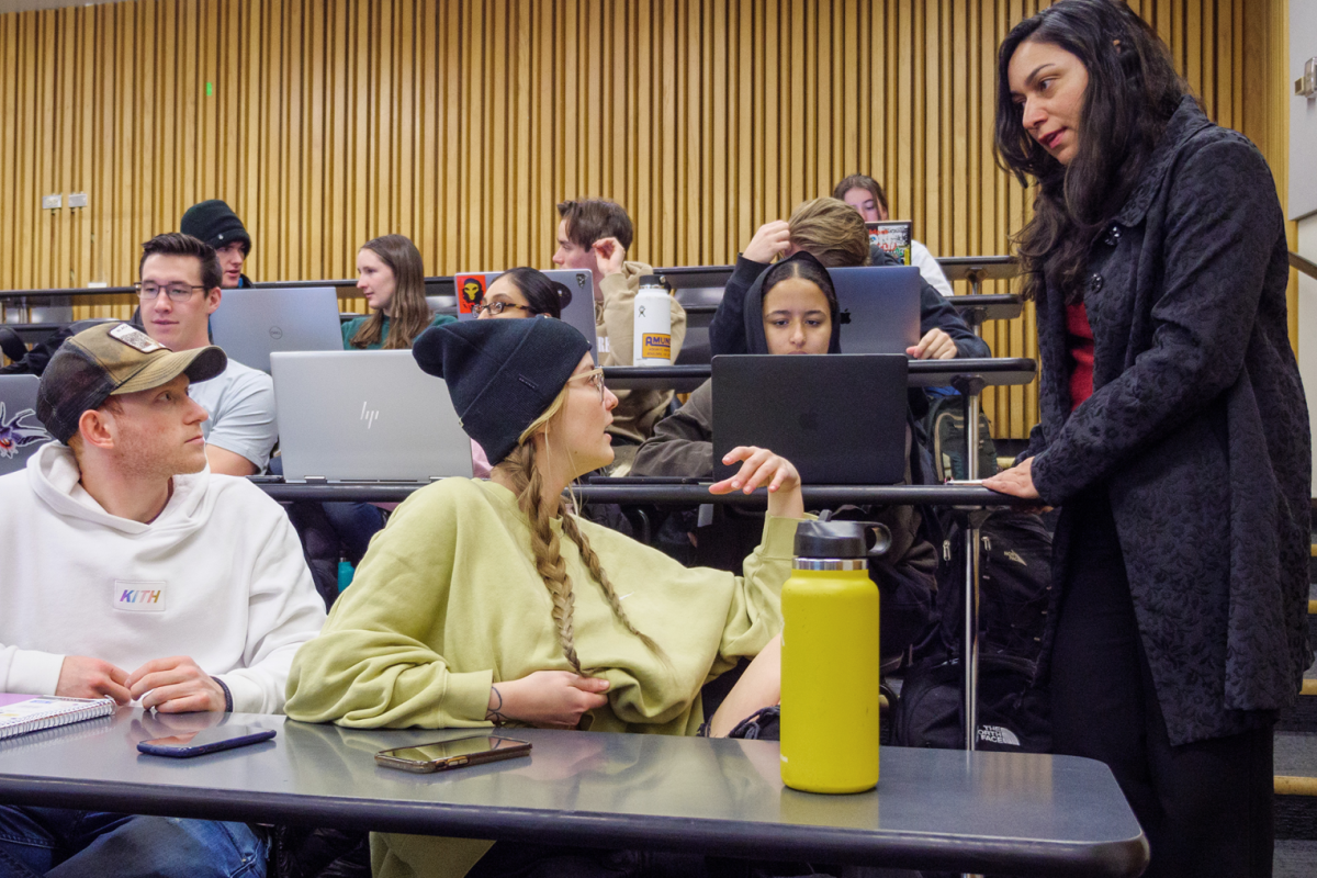 An instructor speaking to students in class