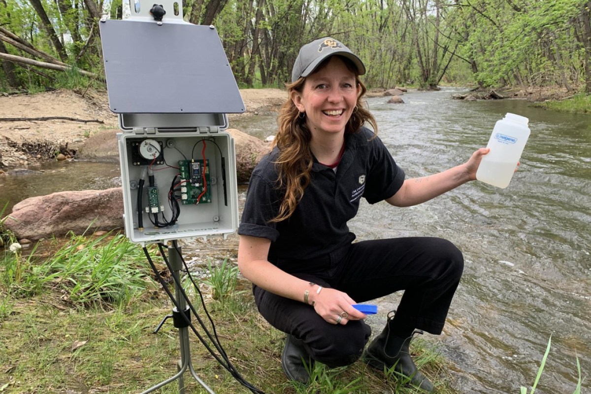 CU student testing creek water