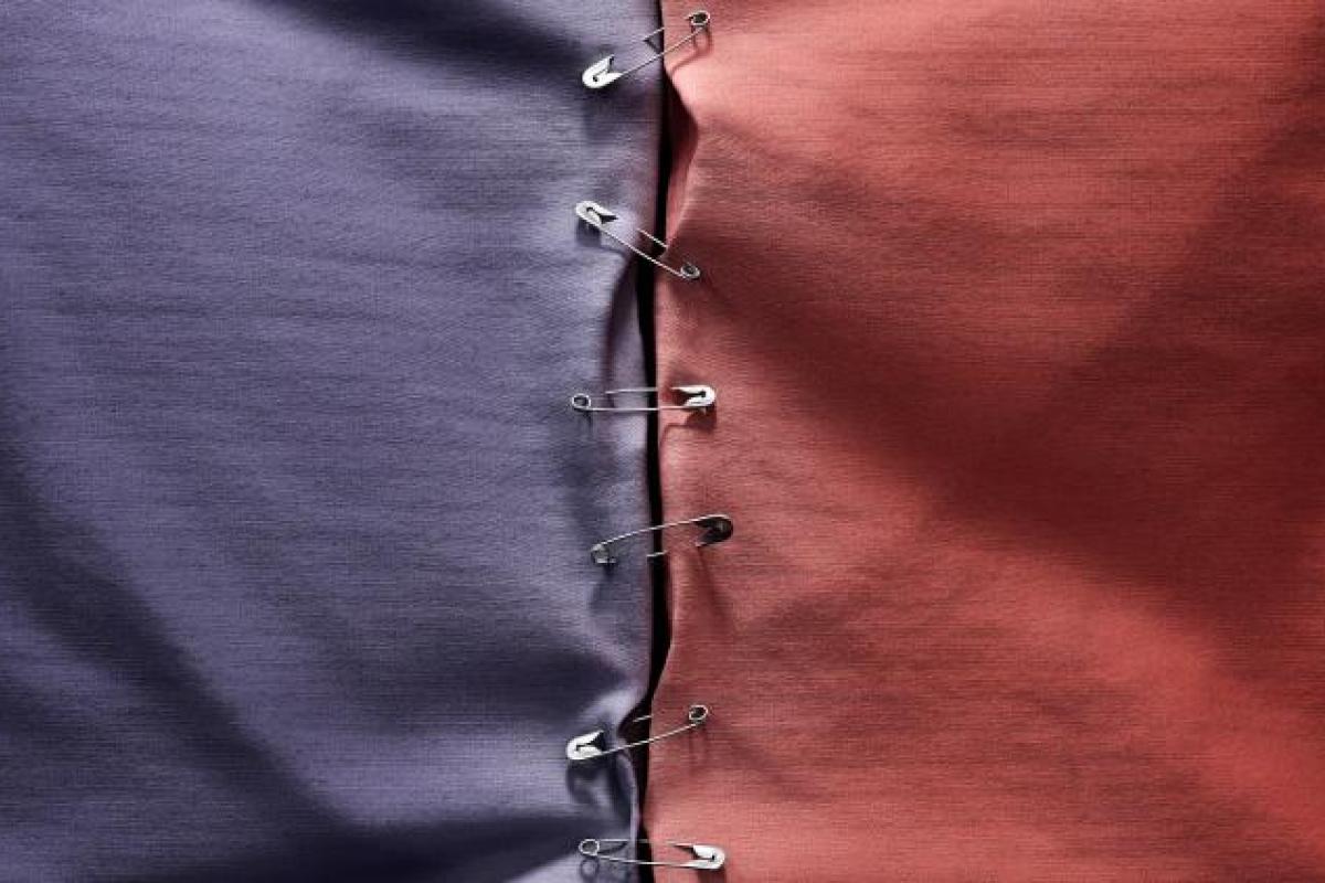 red cloth on left, red cloth on right, pinned together in the middle