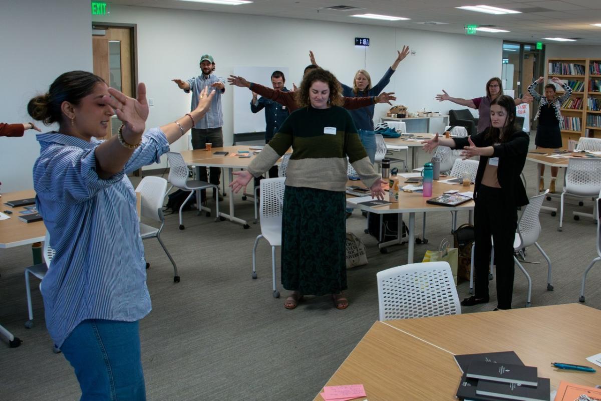 Harveen Gill leads a group meditation during a presentation on her work as an Engaged Arts and Humanities Scholar at Research and Innovation Week. (Photo Credit: Arielle Wiedenbeck)