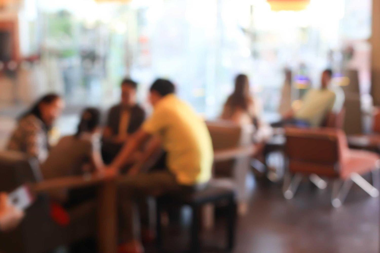 Groups of people sitting at tables