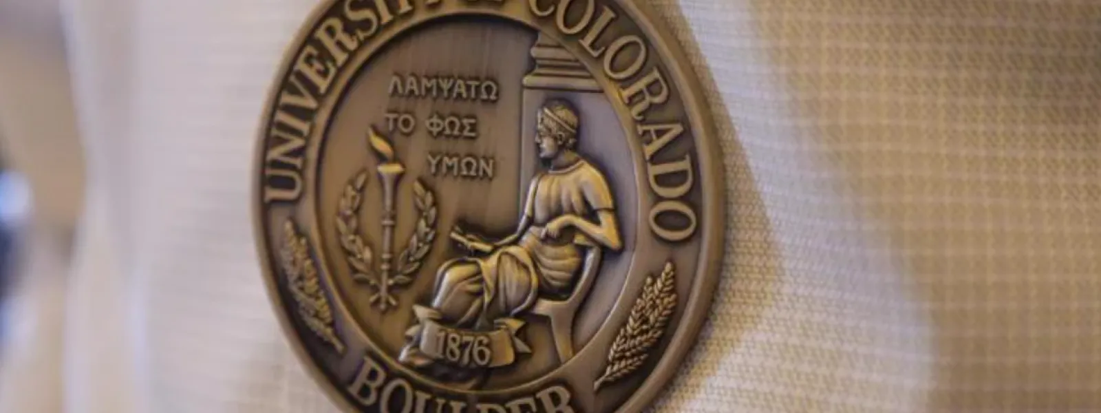 Tenure medal engraved with university seal