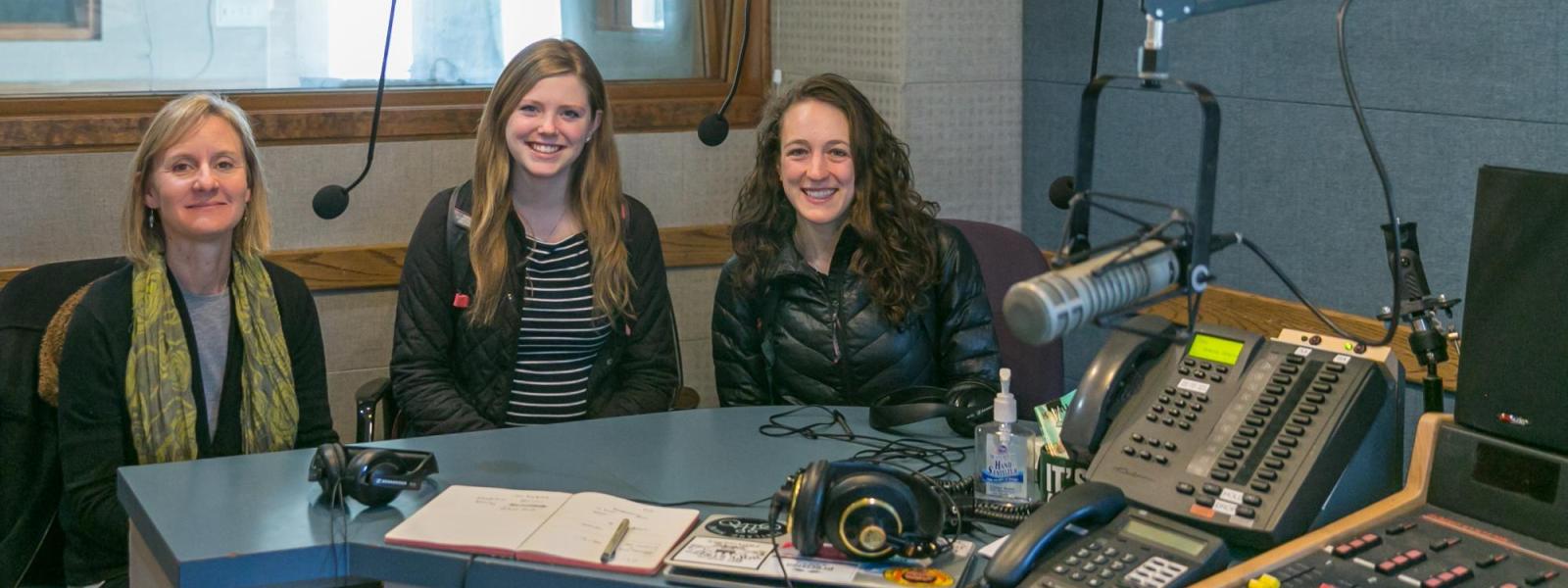 Madaline Pellicore and Emily Schaldach, Commuinity partner Jennifer Korbelik at KGNU