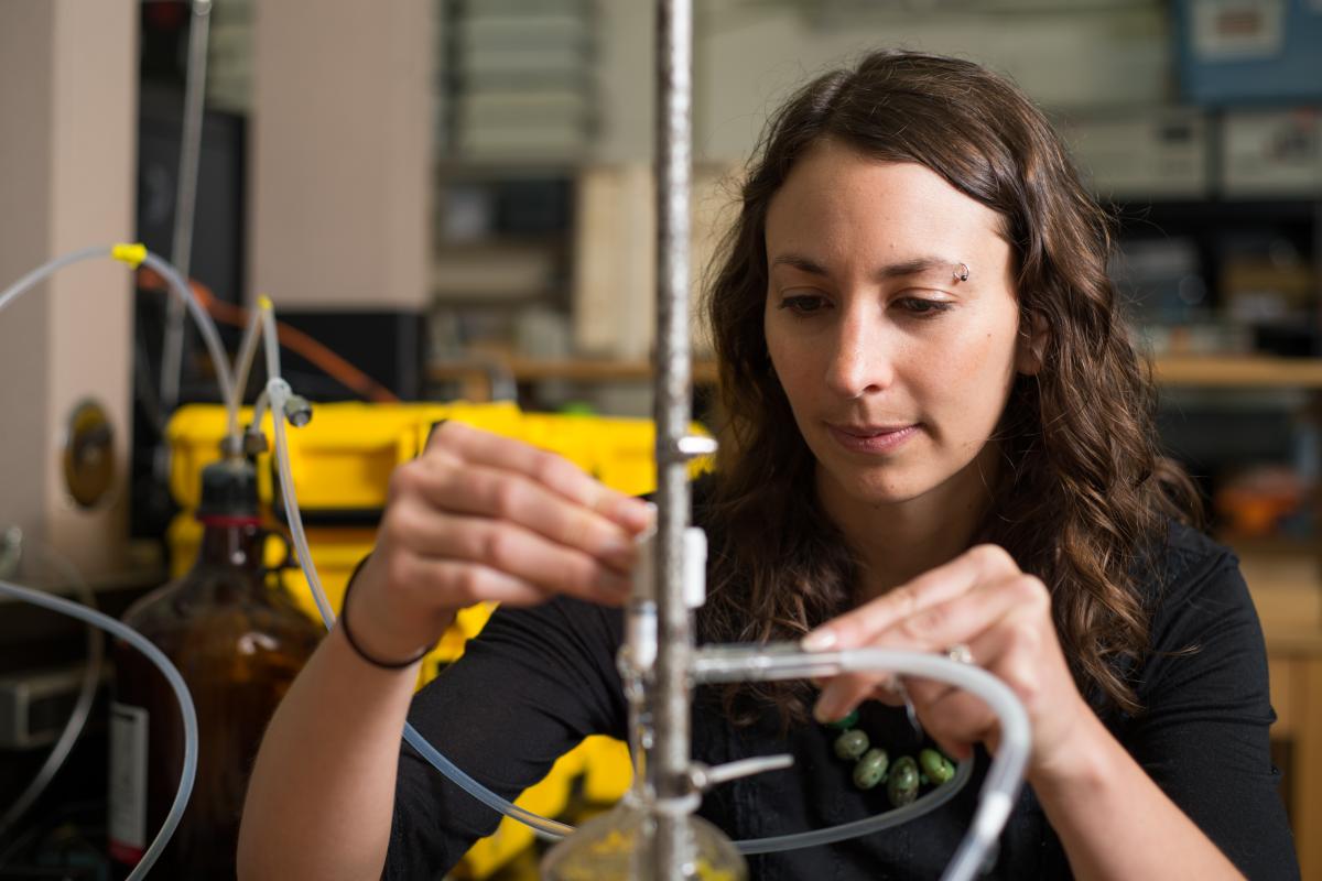 Student working with air quality tubes