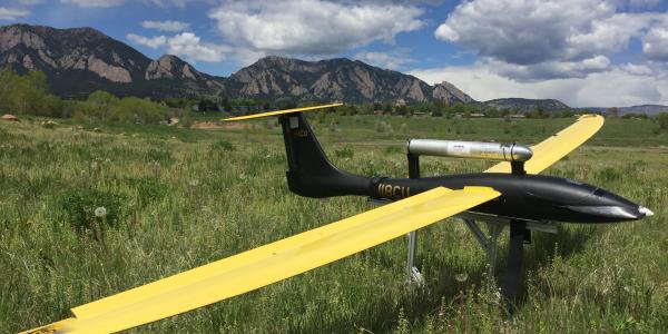 Unmanned Aircraft at rest with the flatirons in the background.