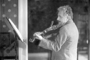 Albert Einstein playing a violin