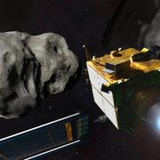 Artist's depiction of the DART spacecraft about to slam into the asteroid Dimorphos.