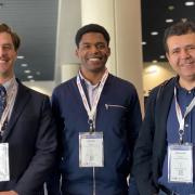 Michael J. Frazier (center) with his PhD advisor Mahmoud Hussein (right) and his PhD advisee Jack Pechac at the ASME IMECE 2023 conference. 
