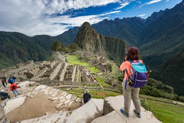 Woman looking at Machu Picchu