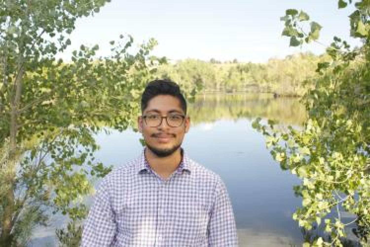 Nicholas Puente in front of a pond