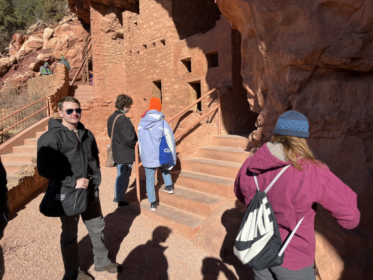 Students outside the cliff dwelling