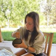 Kelsey with a ceramic bowl