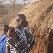 Maasai herder using a cell phone