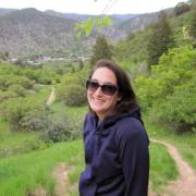 Sarah Kurnick hiking in the field