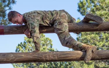 Cadet Kowalczyk successfully transitions over the top of the confidence climb in the obstacle course. Photo courtesy of Cadet Arianna Decker.