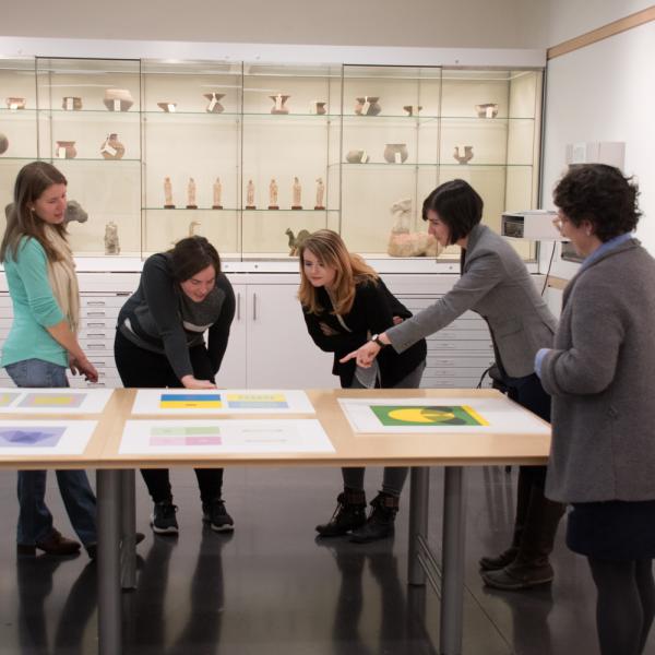 Assistant Professor of Art History, Brianne Cohen and Museum Staff, Hope Saska, in the CU Art Museum Collection Study Center examine and prepare objects for study and display.