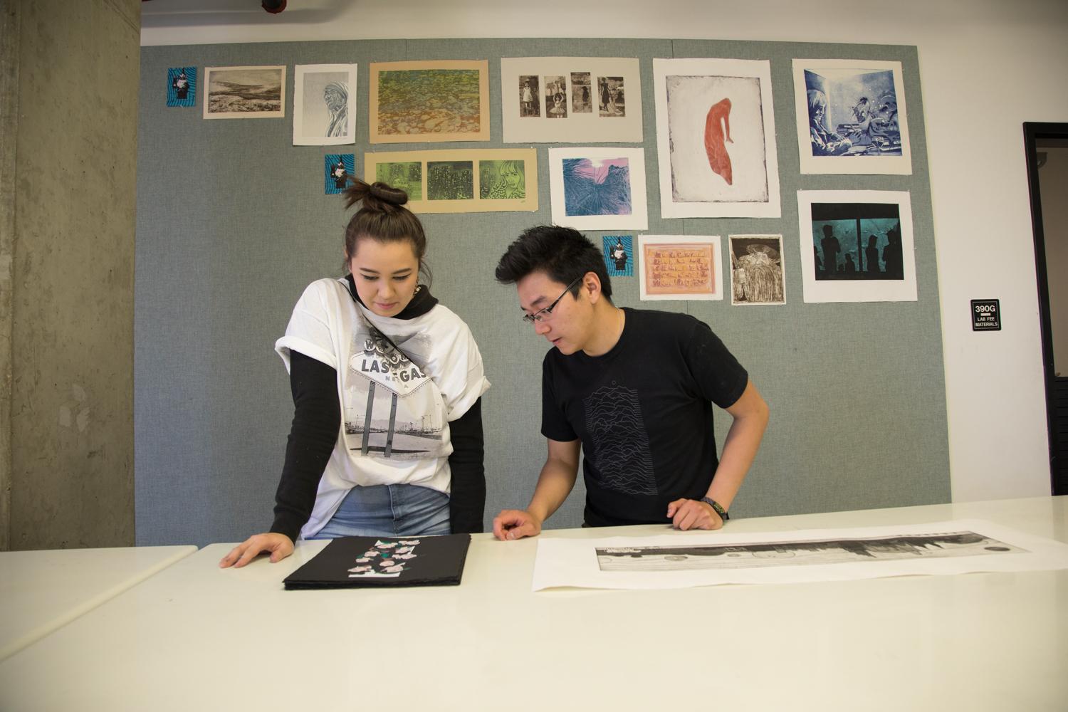 printmaking students looking at prints