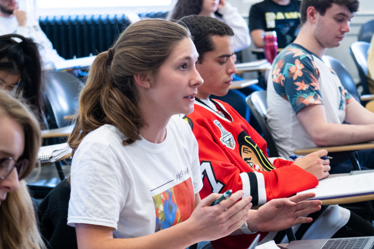 students answer questions in a small Classics lecture