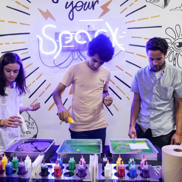 students paint at a spark lab
