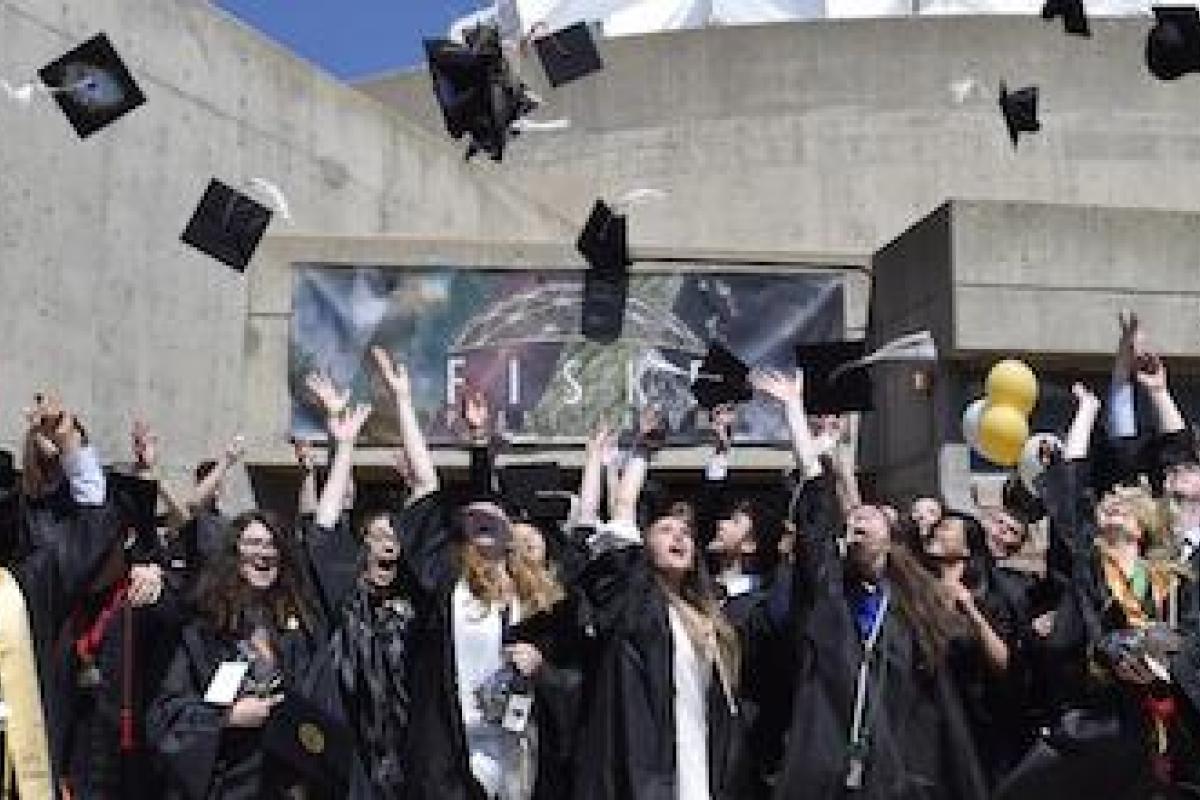 APS graduates celebrate in front of the Fiske Planetarium