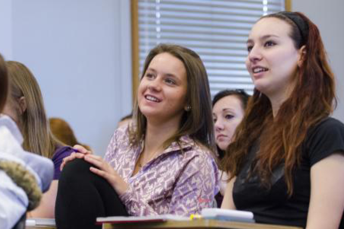 Two students in discussion during a seminar