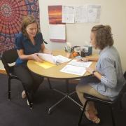 academic coach and student discuss study skills plan