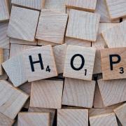 HOPE spelled with Scrabble tiles