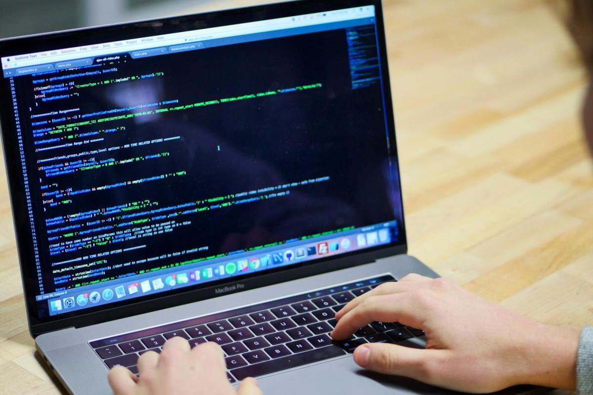 Laptop computer with coding text on screen
