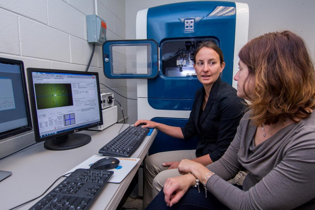Two women in front of computers