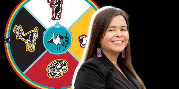 Natasha Myhal with a Marie Tribe of Chippewa flag in the background.