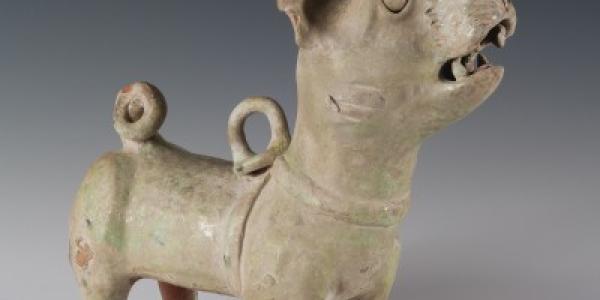 This figurine of a dog by an unidentified Chinese artist dates to the Han Dynasty (206 BCE – 220 CE) and was crafted with earthenware with green and iridescent glaze. It is part of a large gift from Warren and Shirley King to the CU Art Museum. Photo by Jeff Wells.