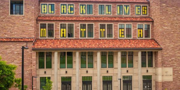 Black Lives Matter in the windows of the buildings