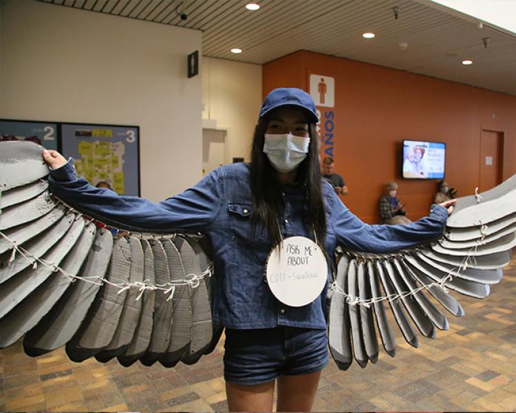 student with bird costume