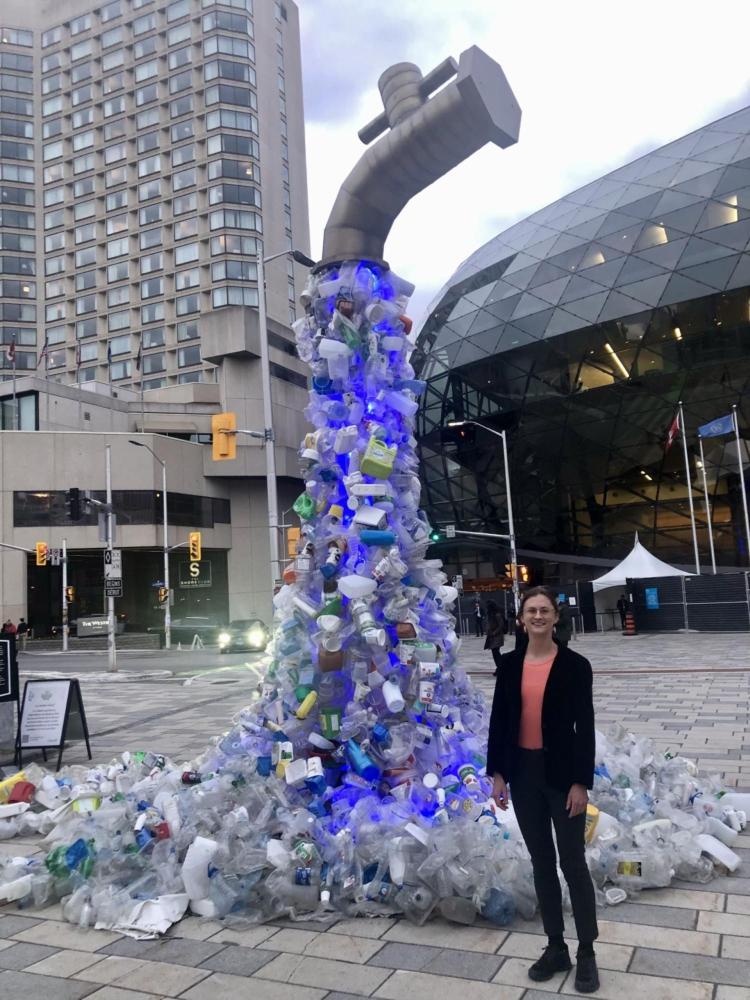 Clare Gallagher by sculpture outside UN treaty session