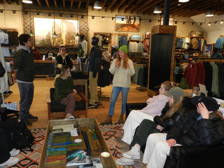 Image of speaker talking to class at the Patagonia store on Pearl Street