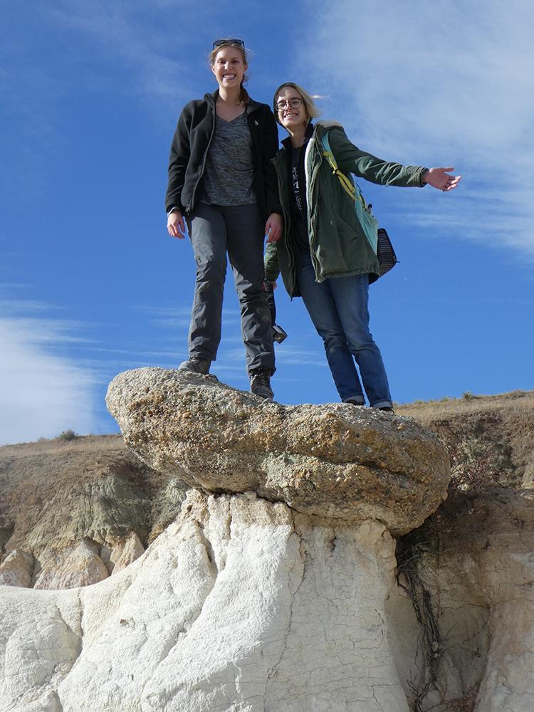 A photo of students Anna Todd (left) and Spencer Zeigler (right) visit the Paint Mines Interpretive Park in El Paso County near Calhan.