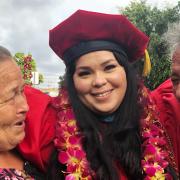A photo of Patricia Gonzalez with her parents at graduation.