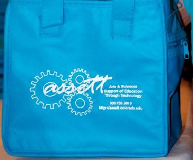 ASSETT staff handed out lunch bags and other goodies at the 2014 COLTT Conference