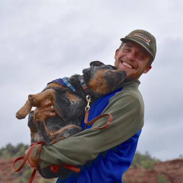 Alexander Randall holding a dog