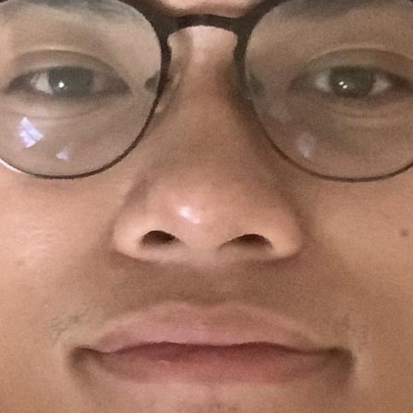 An extreme closeup of Joshua Calugay's face