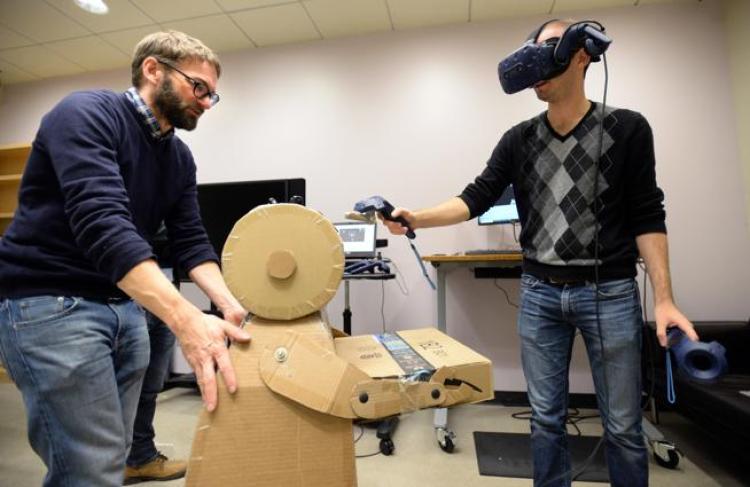 ATLAS Institute graduate student Peter Gyory, right, demonstrates the new 3D design platform he is developing with THING Lab Director Daniel Leithinger. 