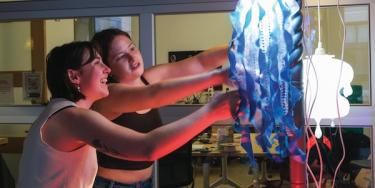 Students working on a jellyfish-like light sculpture
