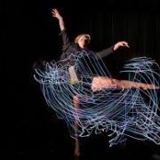 dancer with lights long exposure