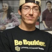 Mason Moran in CU Boulder baseball cap and shirt.