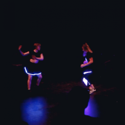 dancers wearing interactive LED costumes