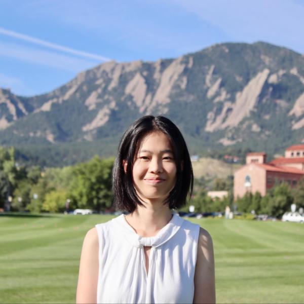 Kelly Cao on the Business Field, with the Flatirons in the background