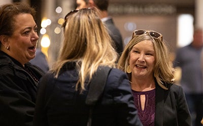 A group of women networking at the event.