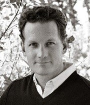 Black-and-white photo of David Sinkey in a dress shirt and sweater.